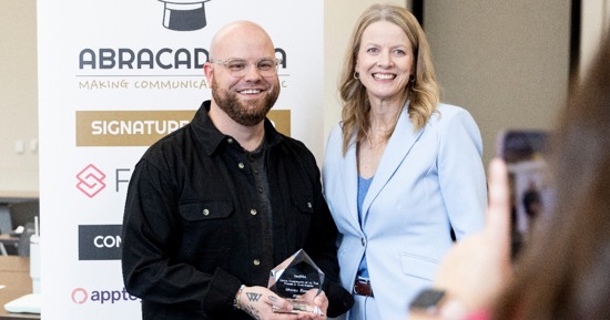 Mitchell Roush, newly named Nebraska School Communicator of the Year, poses with Dr. Jill Johnson, President of Class Intercom. The NebSPRA School Communicator of the Year Award is presented by Class Intercom.