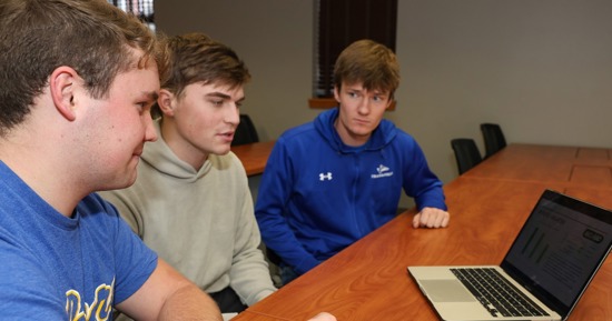 UNK finance students use concepts they’re learning in the classroom to make real investments through the William L. Bauhard Student Managed Investment Fund. From left, seniors Nolan Wetovick, Nathan Grabenstein and Connor Reeson say this experience helps prepare them for their future careers. (Photo by Erika Pritchard, UNK Communications)